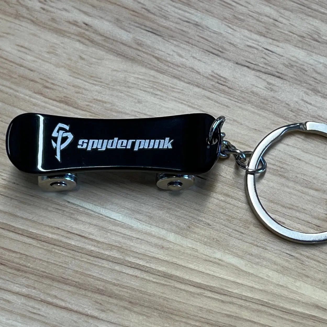 Spyderpunk Skateboard Keychain - Stainless Steel with Rolling Wheels