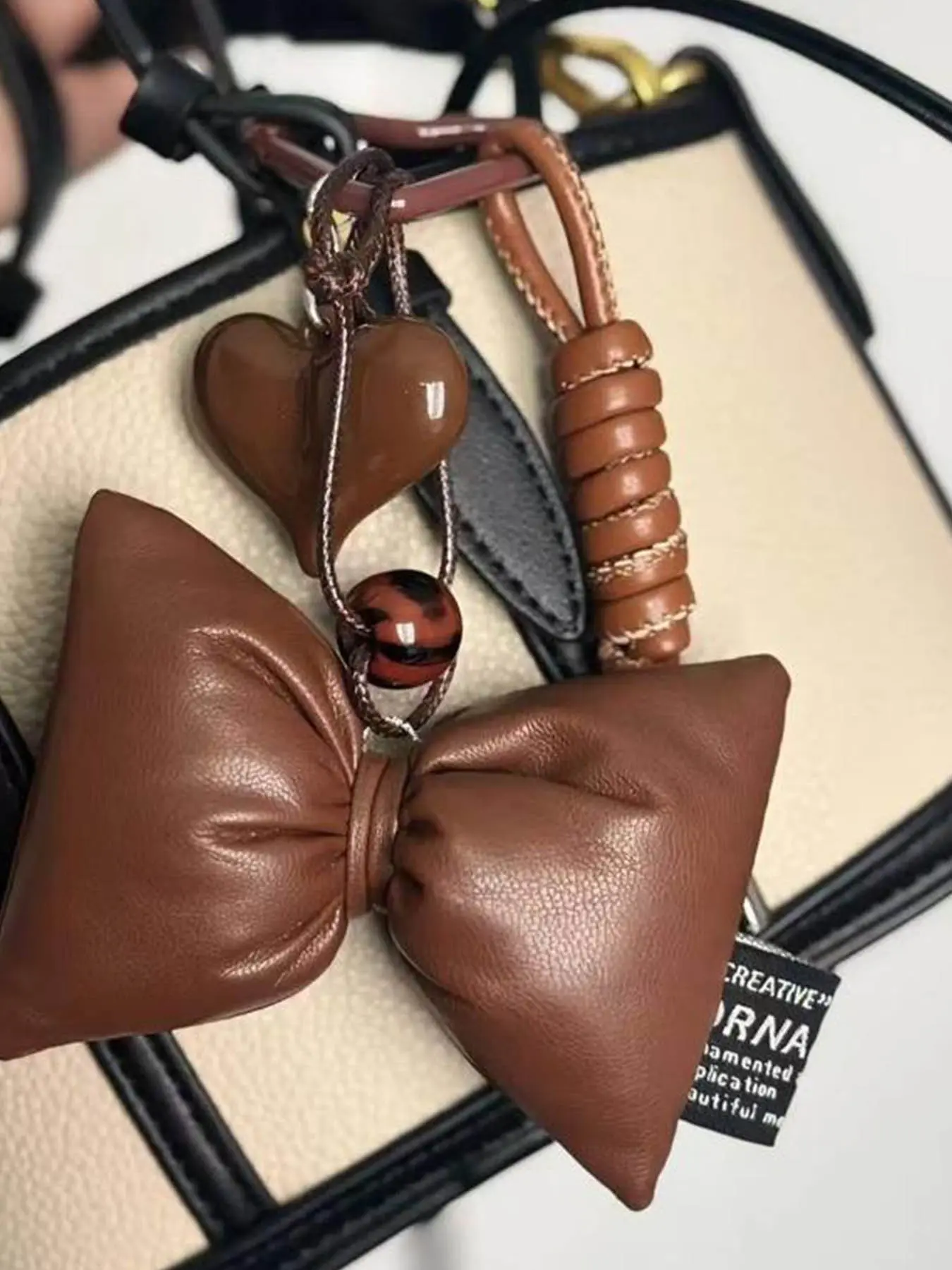Brown Miu Series Bag Charm Textured Leather Stylish HighEnd Handmade Autumn Winter Brown Bag Pendant withBow and Heart Accents Fashion Bag Charms Accessories For Bags, Purse Charms For Handbags, Purse Charm