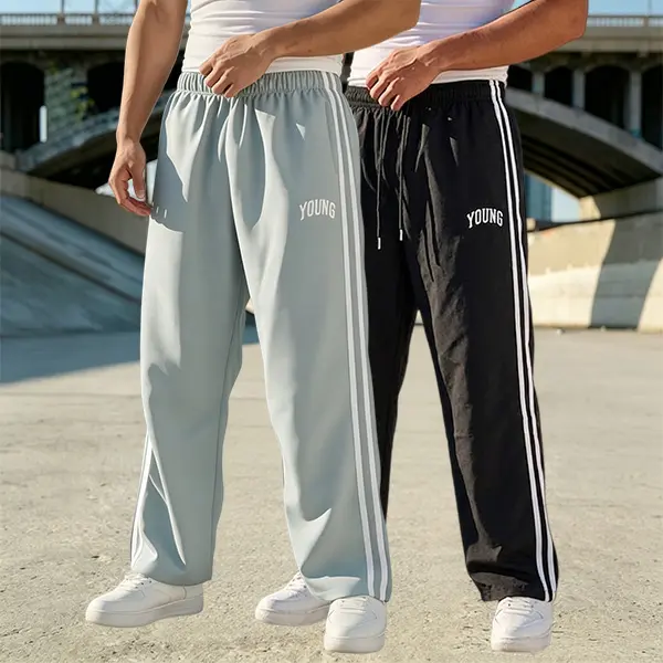 Men’s straight-leg casual pants with side double stripes, available in two colors, featuring “YOUNG” embroidered lettering and an elastic waistband with drawstring.
