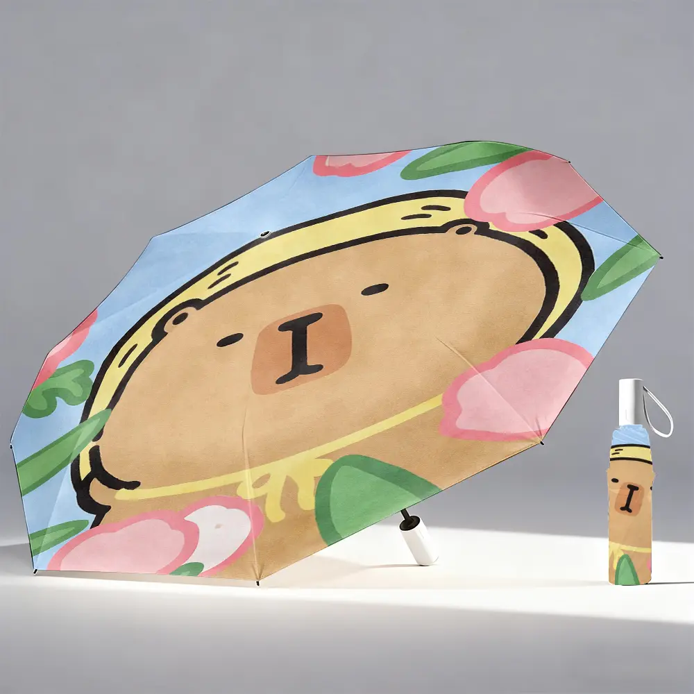 Foldable umbrella featuring a large beige Rilakkuma bear face motif surrounded by flowers and green leaves. Perfect for travel, backpacking, and gifting.