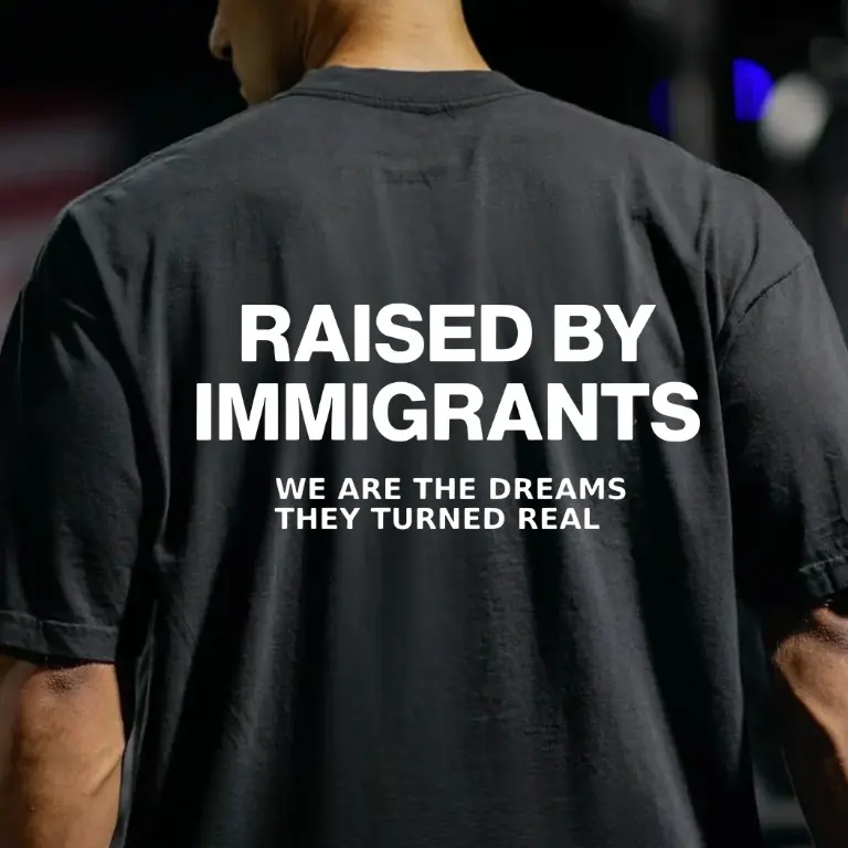 Raised By Immigrants T-Shirt, Inspirational Quote Graphic Tee for Men & Women, Unisex Streetwear Top, Motivational Message Shirt