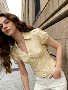 A women's fashionable yellow and white striped bubble sleeve short shirt adds sweetness, with a short silhouette that is proportionate and suitable for commuting to work, shopping, outdoor activities, indoor and outdoor dressing