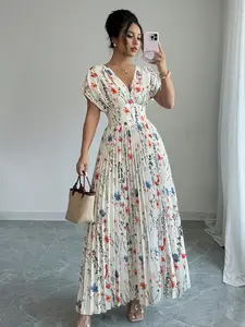 A fashionable white background pleated skirt Dress with colorful floral prints for women. The colorful floral prints make it lively, and the pleated skirt is elegant and suitable for commuting to work, shopping, and outdoor wear