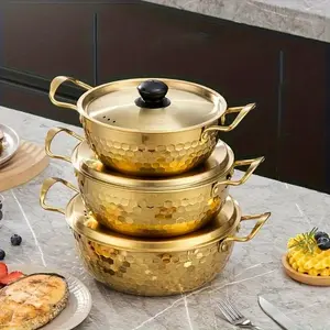 Gold stainless steel noodle pot with lid. Durable non-stick, dishwasher safe, textured base for even heating. Ideal for home, camping, parties, restaurant. Elegant gold finish, modern kitchen essential