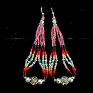 These handmade Navajo beaded earrings are embellished with super pink seed beads, fire-designed seed beads, turquoise colored seed beads, silver alloy daisy-shaped beads, and silver plated rose buds.