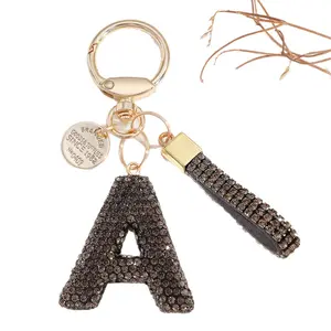 Chic Black Bow & Rhinestone Alphabet Keychain - Alloy Cartoon-Themed Charm for Bags & Cars Perfect Gift for Women Fashionable Novelty Key Chains with Lobster Clasp