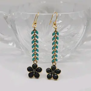 Playful turquoise colored dangle earrings. These are very lightweight & comfortable to wear. Choose from flowers in black, white or turquoise in color. Measurements are 2.5" long and .5" wide. All products are nickel free. Thank you for shopping small!