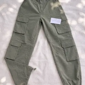 Avenida Olive Green Cargo Pants with Multiple Pockets and Adjustable Cuffs for Comfortable Wear