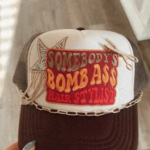 Brown hairstylist trucker