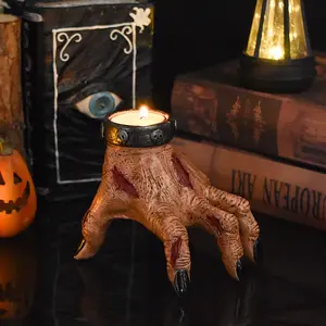 A terrifying and scarred ghost hand candlestick, a creepy and wonderful home fireplace coffee table decoration for Halloween, a thrilling, novel and practical ghost hand candlestick home decoration, a resin handicraft