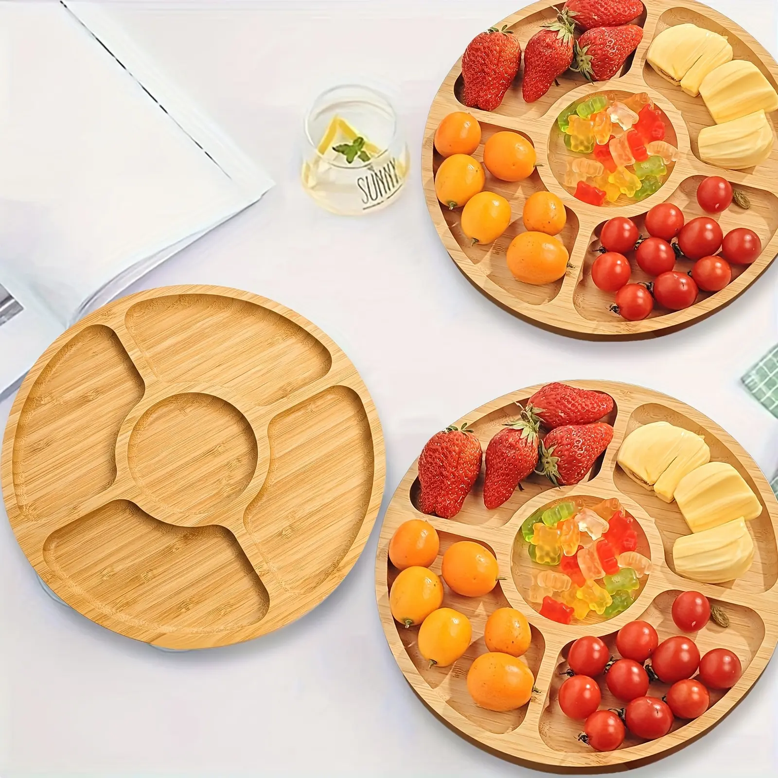 A Bamboo Round Snack Tray with Five Compartments, Suitable for Serving Snacks, Storing Items, And Using on Coffee Tables. It Is Made of Food-Grade Materials And Is Perfect for Home Decor, Desserts, Snacks, And Fruits