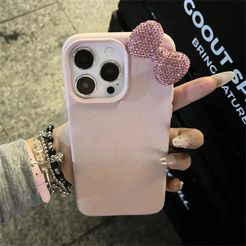 Cute Pink Leather Texture iPhone Case with 3D Bling Rhinestone Bow, Soft Matte Shockproof Girly Phone Cover, Sparkly Crystal Bow Coquette Aesthetic Protective Case for Women Daily Party Use TikTok 2026