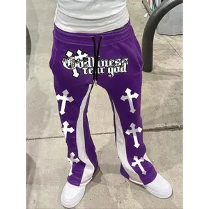 Men’s casual loose jogger pants with a drawstring waist and letter print, made from medium-weight fabric suitable for all seasons—trendy streetwear for young adults