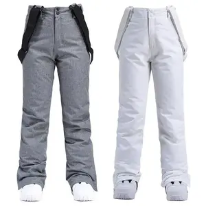 New ski pants for men and women, suitable for single or double boards, windproof and waterproof, with a detachable elastic waistband, thickened warm cotton pants for men.