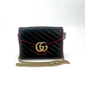 Pre-owned GUCCI Marmont Torchon Wallet on Chain in black quilted leather with red trim