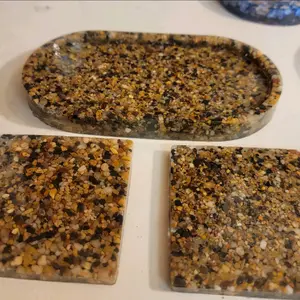 Epoxy Resin Trinket Tray and Coasters With Stones embedded inside.