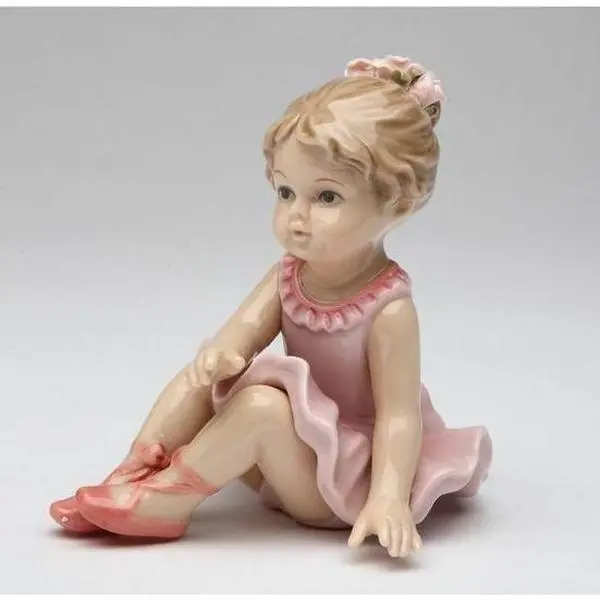 Porcelain Ballerina with Ballet Slippers Warming Up Figurine