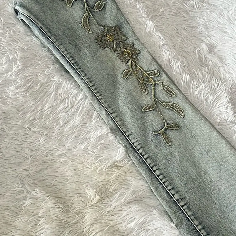 Vintage Joana Design Light wash flare jeans with embroidery on the leg