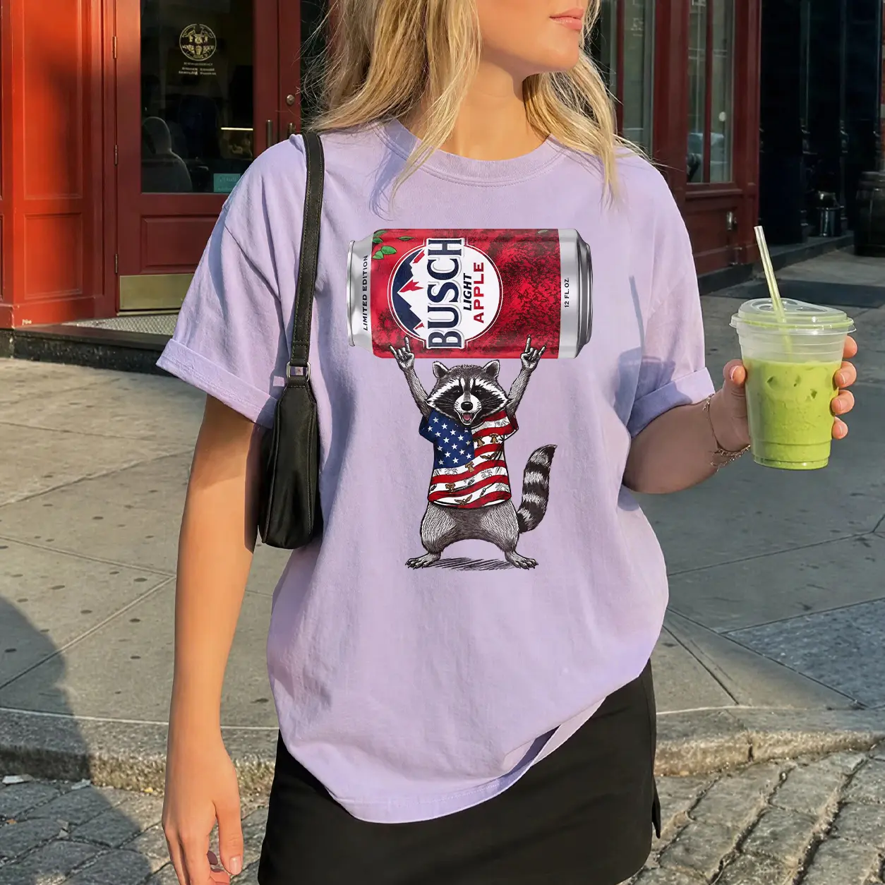 Busch Apple Raccoon T-Shirt, Funny Rocking Raccoon with Beer Can Graphic Tee, Patriotic American Flag Shirt, Unique Summer Party Apparel, Gift for Beer and Raccoon Lovers cotton tee