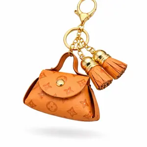 Orange Keychain with Tassels and Gold Hardware - Stylish Accessory for Keys and Bags