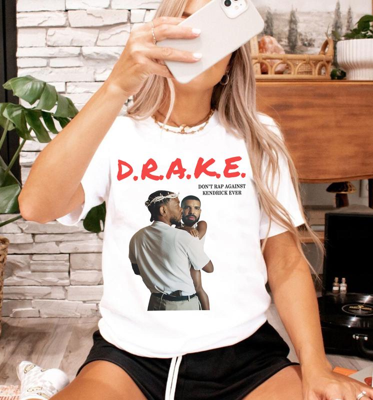 Kendrck L@mar Holding Baby Drake Unisex Cotton T-Shirt, Not Like Us, Euphoria, Meet the Grahams, Family Matters, BBL Drizzy, Liar