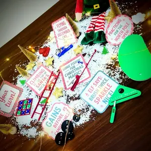7 Day Lazy Parent Elf Prop Kit for Christmas with Ladder Fishing Pole Weights Putting Green Tic-Tac-Toe Board, Door Hanger & more