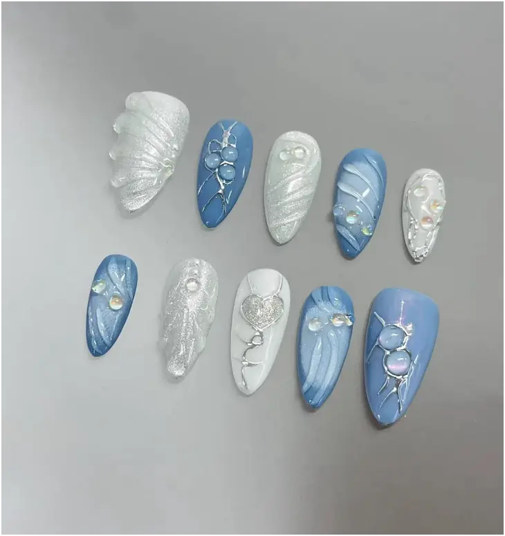 Silver blue 3D press-ons, custom handmade faux acrylics with a gel finish, offering a stylish and unique manicure look.