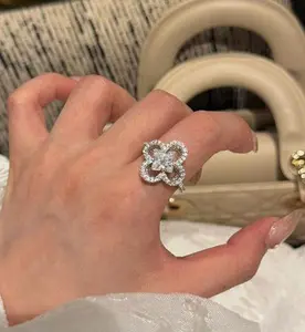 Twin Four-Leaf Clover Ring with Four-Pointed Star Cut Cubic Zirconia