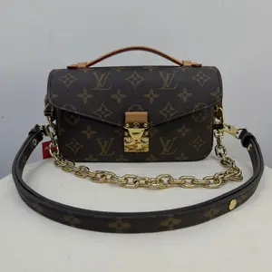 Pre-owned Louis Vuitton Pochette Métis East West Mini in Monogram Canvas with Gold Tone Hardware