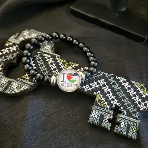 Black Beaded Bracelet with I Love Palestine Heart Charm Featuring Palestinian Flag Design