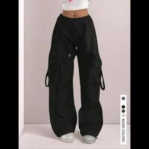 High waisted drawstring comfortable wide leg work pants, elastic cuffs and folding pockets, suitable for casual street style underwear fabric