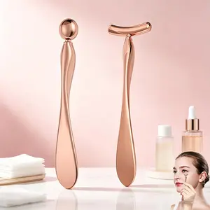 Two rose gold metal face and eye massage tools, double end skin care device and T-shaped roller, cooling alloy rod for applying eye cream and essence, reducing swelling and fine lines, household facial beauty tools