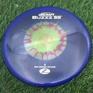 Discraft Elite Z Fly-Dyed BuzzzSS - 175.1g - Purple And Yellow Starburst On Blue Dyed