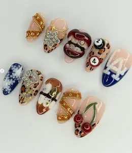 Funky LA Street Nails — bold mix of leopard print, 3D cherries, gold chains, pool balls, and glitter stars for a wild Y2K-inspired urban glam statement.