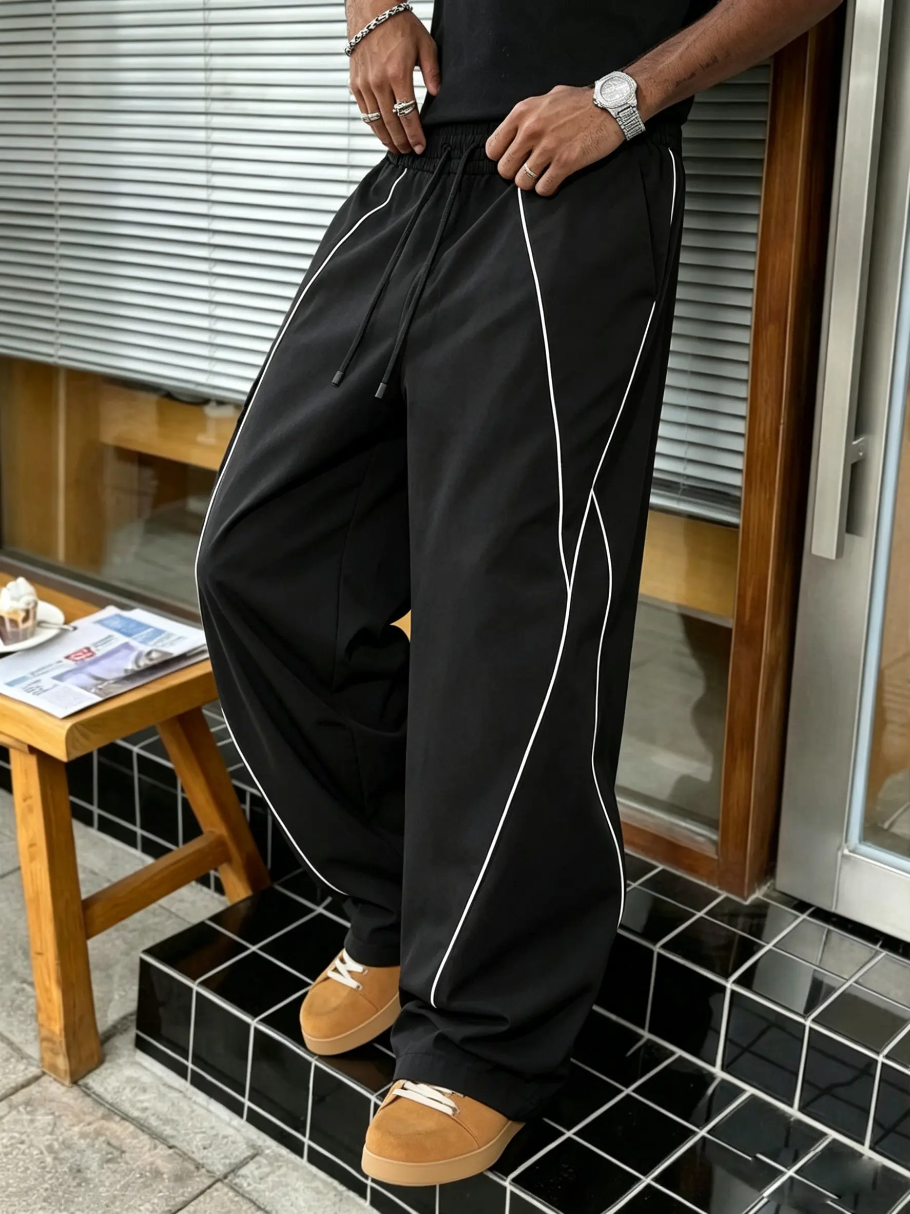 Men’s multi-purpose wide-leg sports pants featuring a striped spliced design, drawstring elastic waistband, breathable lightweight fabric—perfect for tennis, commuting, summer, and everyday casual wear.