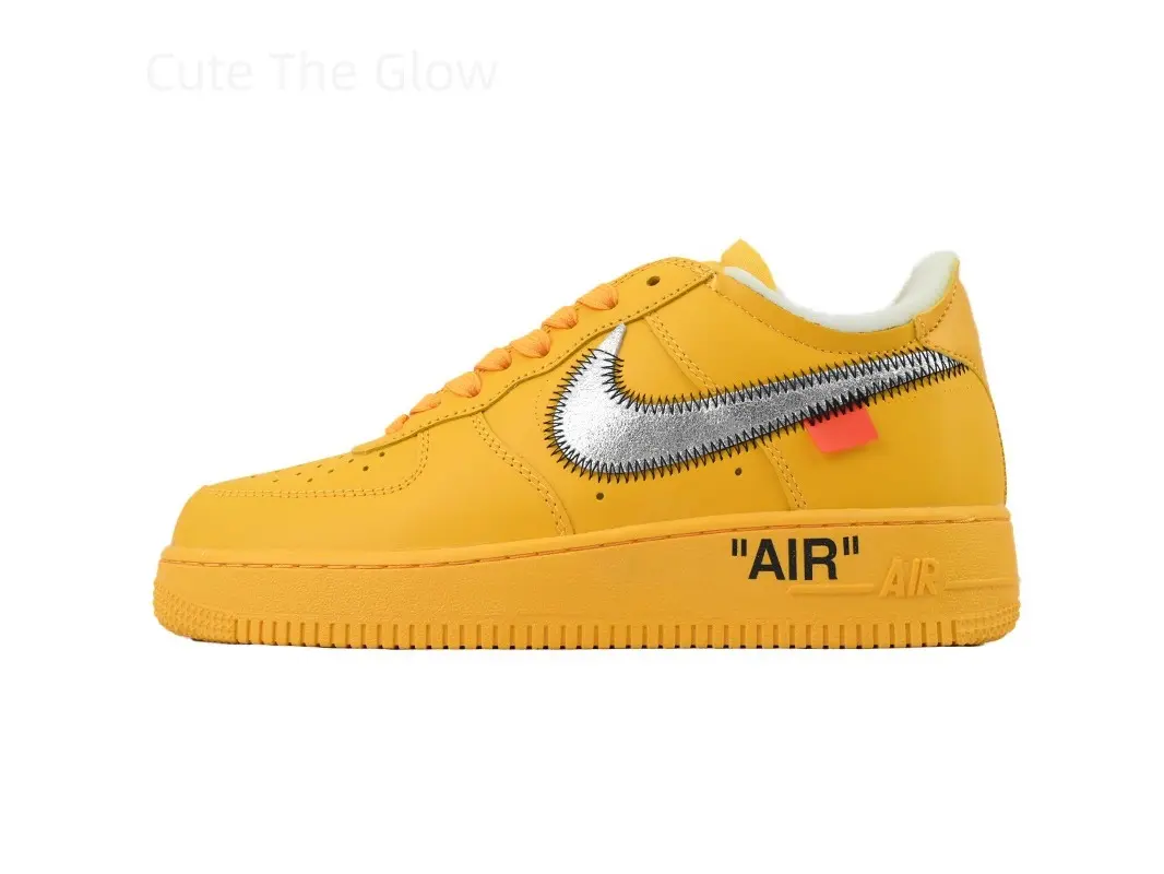 Bright mustard yellow smooth leather low top skate sneakers, reflective silver raw stitching side logo with mini orange tag, shock-absorbing matching yellow rubber sole, unisex bold trainers for hip-hop outfits, skateboarding and street party styling