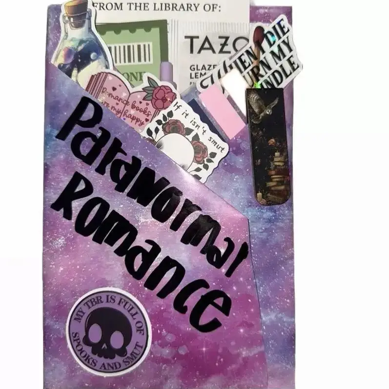 Blind Date With a Book – Dive into Romance, Fantasy, Smut & More! Each surprise book bundle includes curated tea, bookmarks, tabs, stickers, pens, and