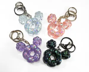 Glitter Bloom Donut Ears Keychain - Sparkly Resin Bag Charm in Ice Blue, Peach Pink, Galaxy Black, and Lilac - Cute Mochi Style with Lobster Clasp
