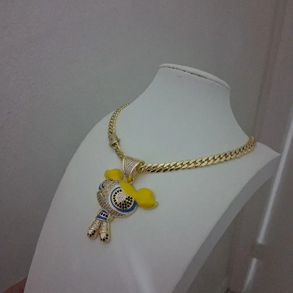 14k plated chain ,8mm thickness,16inches long ,with a yellow charm of a doll