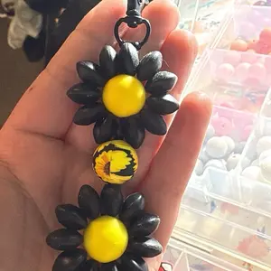 Flower Keychains with Yellow Center and Black Petals for Stylish Accessory