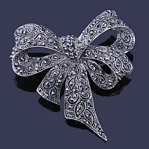 2025 Jewelry Design TRPOPSYN Blue Rhinestone Bowknot Brooches For Women Vitage Metal Flower Weddings Party Office Brooch Pins Gifts
