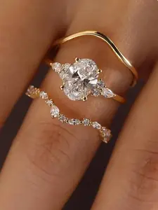 Elegant Oval Zirconia Ring Trio Statement Multi Ring Engagement Ring Set. Features a unique, sparkling layered design that radiates an aura of luxury. Ideal for weddings, galas, and parties, this set serves as the perfect jewelry gift.