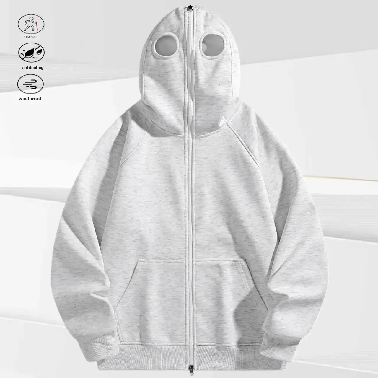 A men's zip up hoodie with a unique eye hole cutout design