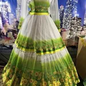 Shifon Chiffon Dress for Ethiopian and Eritrean Women with Green and Yellow Floral Design and White Tulle Skirt