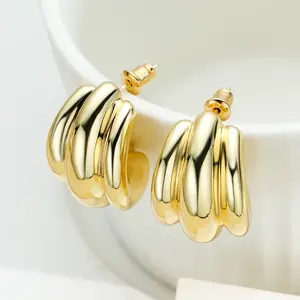 Golden-colored earrings with a pumpkin-shaped design