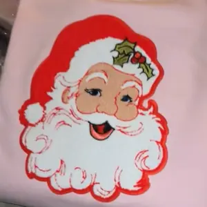 Santa Claus Chenille Patch on a Light Pink Gildan Sweatshirt