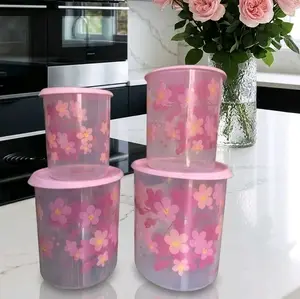 Set of dry food storage canisters, translucent with pink decoration.