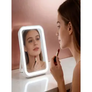 Portable and compact makeup mirror with high-definition mirror surface, featuring three adjustable gloss effects, foldable design and supporting USB charging. Suitable for travel and daily use. An excellent gift choice for Valentine's Day. Ideal for those
