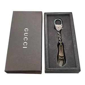 Pre-owned GUCCI Metal Bag Charm GG Logo Gold Tone Shoe Design Key Chain #255 Elegant & Sophisticated Accessory for Everyday Use