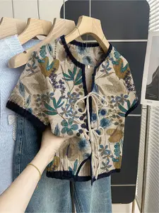 Women's khaki bohemian vacation short-sleeve knit top. Loose round neck, contrast leaf print, front tie and contrast piping. Comfortable for spring & summer casual wear. Casual Boho Soft